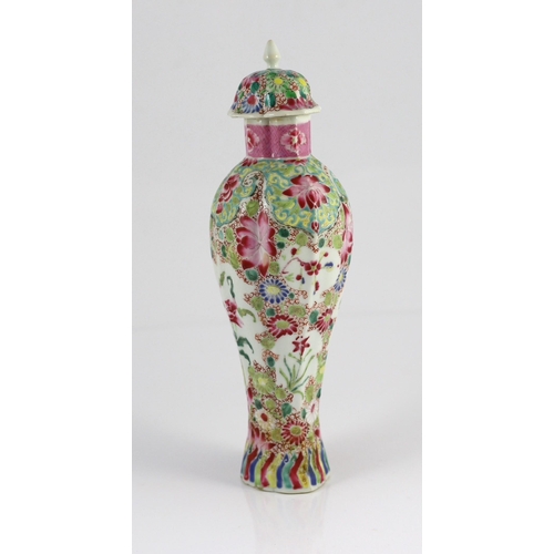 128 - A Chinese famille rose moulded baluster vase, Qianlong period, painted with trailing flowers on a ce... 