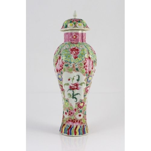 128 - A Chinese famille rose moulded baluster vase, Qianlong period, painted with trailing flowers on a ce... 