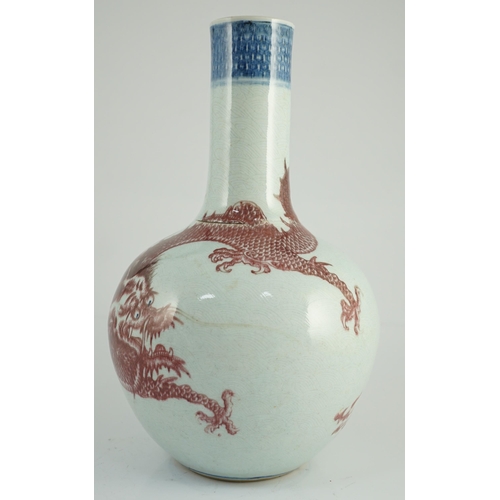 129 - A rare Chinese underglaze blue and copper red 'dragon' vase, tianqiuping, 18th century, painted with... 