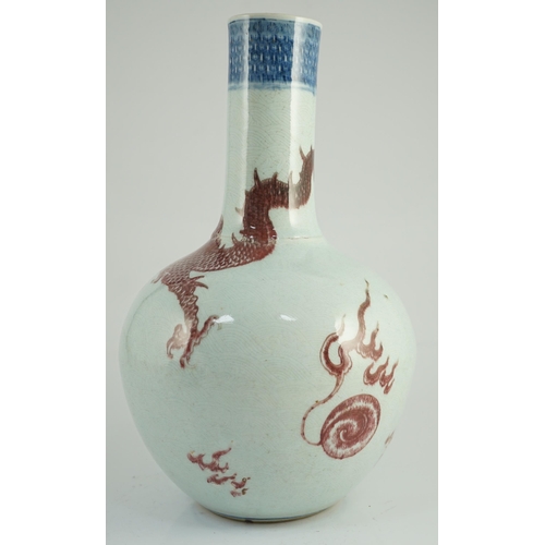 129 - A rare Chinese underglaze blue and copper red 'dragon' vase, tianqiuping, 18th century, painted with... 