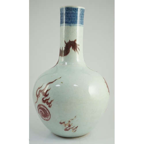 129 - A rare Chinese underglaze blue and copper red 'dragon' vase, tianqiuping, 18th century, painted with... 