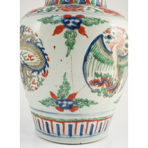 130 - A Chinese Transitional wucai dragon and phoenix roundel vase, 17th century, the roundels between f... 