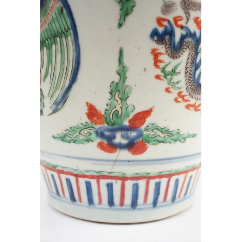 130 - A Chinese Transitional wucai dragon and phoenix roundel vase, 17th century, the roundels between f... 