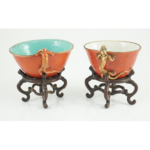 132 - Two similar Chinese coral ground libation cups, late 18th/early 19th century, each of oval tapering ... 