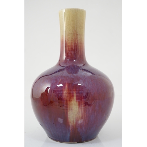 133 - A Chinese flambe bottle vase, tianqiuping, 19th century, the mushroom coloured glaze of the neck gra... 