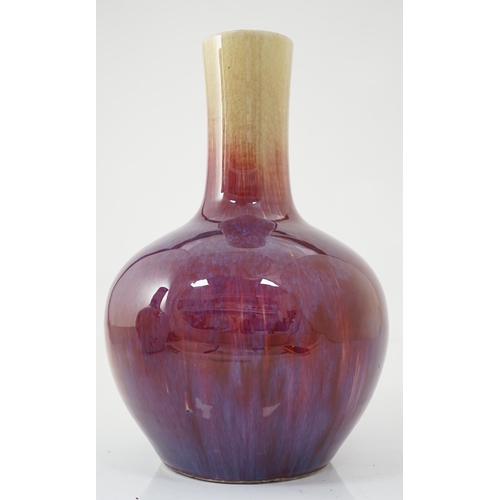 133 - A Chinese flambe bottle vase, tianqiuping, 19th century, the mushroom coloured glaze of the neck gra... 