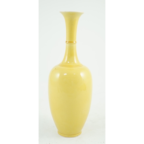 134 - A Chinese yellow glazed bottle vase, Kangxi mark possibly Republic period, 24.2cm high