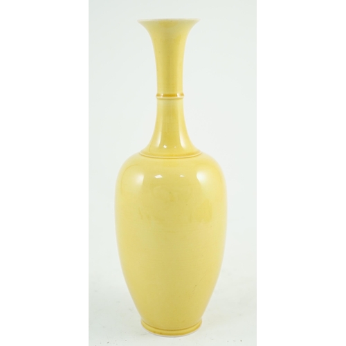 134 - A Chinese yellow glazed bottle vase, Kangxi mark possibly Republic period, 24.2cm high