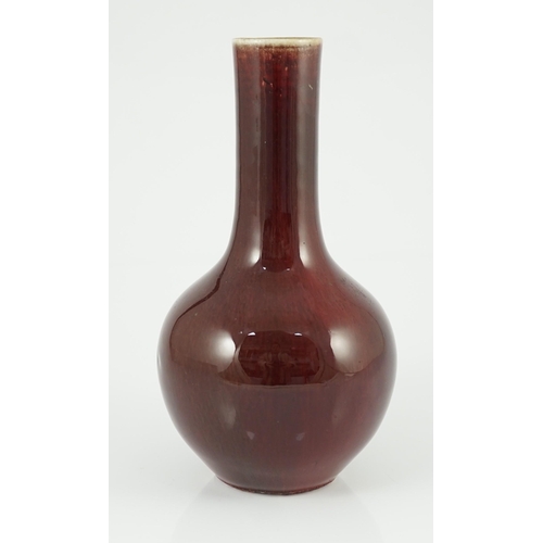 138 - A Chinese sang-de-boeuf glazed bottle vase, 18th/19th century, with mushroom glaze at the rim gradua... 