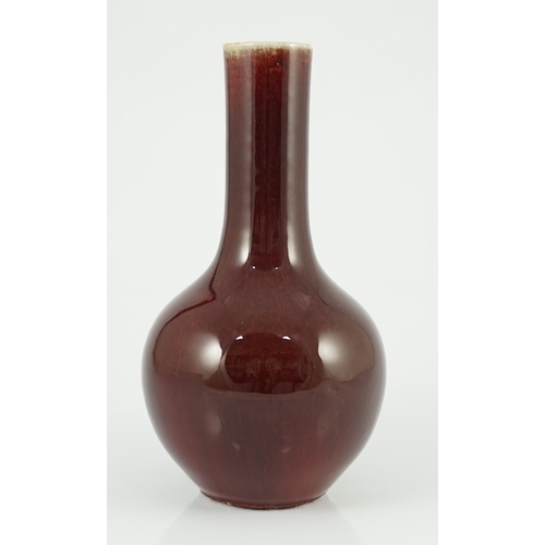 138 - A Chinese sang-de-boeuf glazed bottle vase, 18th/19th century, with mushroom glaze at the rim gradua... 