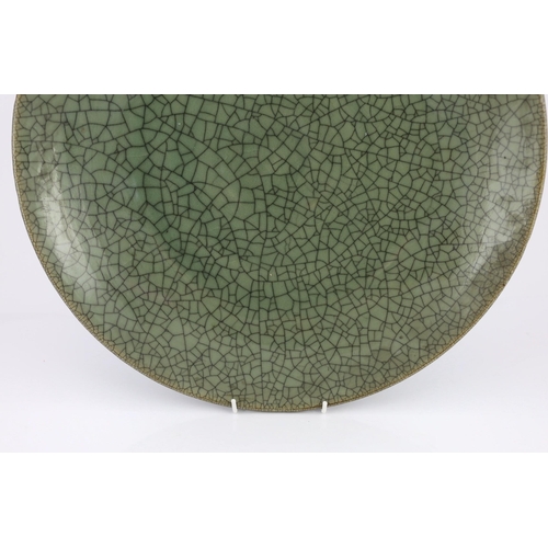 140 - A large Chinese Guan type crackle glaze dish, 19th/20th century, 45.5cm diameter