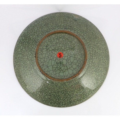 140 - A large Chinese Guan type crackle glaze dish, 19th/20th century, 45.5cm diameter