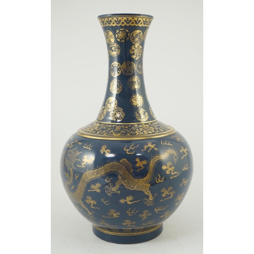 143 - A Chinese gilt decorated blue ground dragon vase, Guangxu mark but later, the neck decorated with ... 