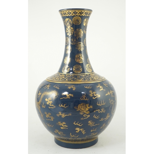 143 - A Chinese gilt decorated blue ground dragon vase, Guangxu mark but later, the neck decorated with ... 