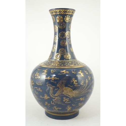 143 - A Chinese gilt decorated blue ground dragon vase, Guangxu mark but later, the neck decorated with ... 