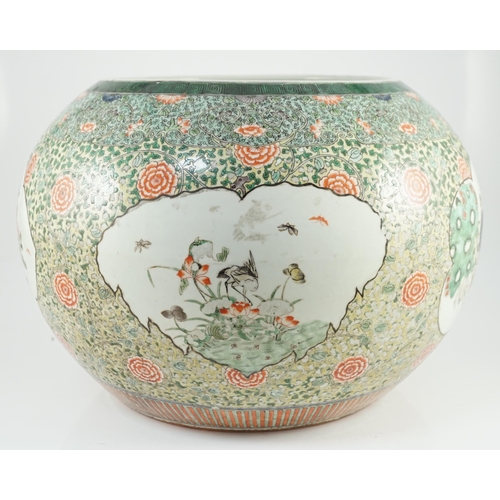 151 - A large Chinese famille verte jardiniere or fish bowl, 19th century, painted to four reserves with a... 