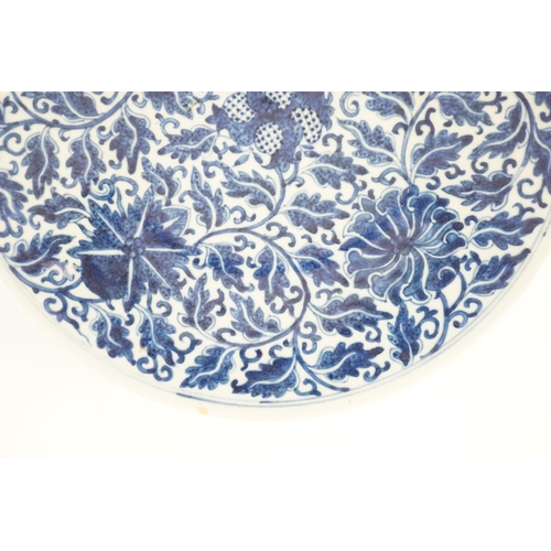 158 - A Chinese blue and white dish, Kangxi mark, 19th century, the centre painted with four pomegranates ... 