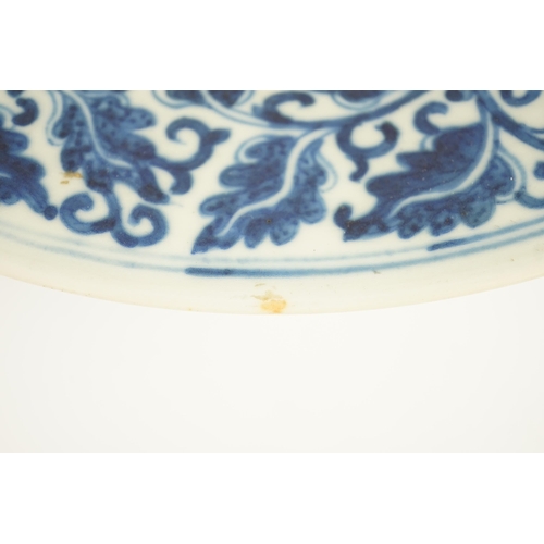 158 - A Chinese blue and white dish, Kangxi mark, 19th century, the centre painted with four pomegranates ... 