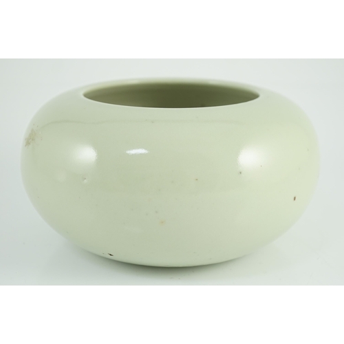 164 - A Chinese celadon glazed water pot or alms bowl, late 19th century, with concave and unglazed base, ... 