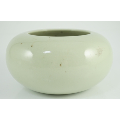 164 - A Chinese celadon glazed water pot or alms bowl, late 19th century, with concave and unglazed base, ... 