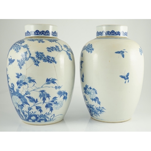 165 - A pair of large Chinese blue and white ovoid jars and associated covers, 19th century, each painted ... 