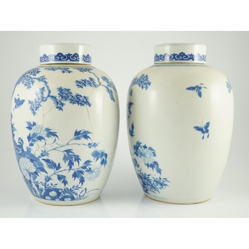 165 - A pair of large Chinese blue and white ovoid jars and associated covers, 19th century, each painted ... 