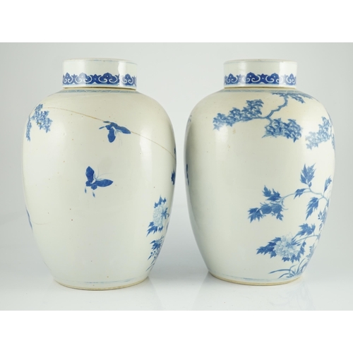 165 - A pair of large Chinese blue and white ovoid jars and associated covers, 19th century, each painted ... 