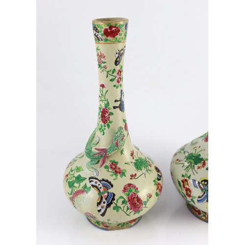 166 - A pair of Chinese enamelled porcelain crackle glaze bottle vases, mid 19th century, each painted wit... 