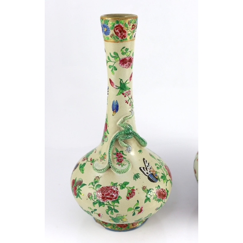 166 - A pair of Chinese enamelled porcelain crackle glaze bottle vases, mid 19th century, each painted wit... 