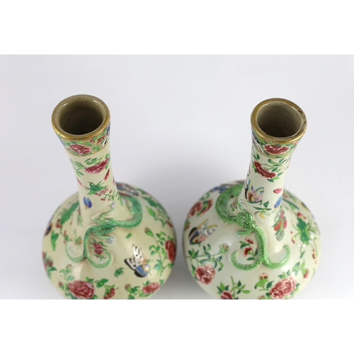 166 - A pair of Chinese enamelled porcelain crackle glaze bottle vases, mid 19th century, each painted wit... 