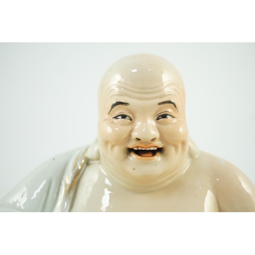 170 - A large Chinese porcelain seated figure of Budai, Republic period, holding a rosary of beads in his ... 