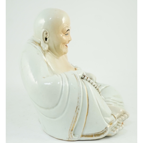 170 - A large Chinese porcelain seated figure of Budai, Republic period, holding a rosary of beads in his ... 