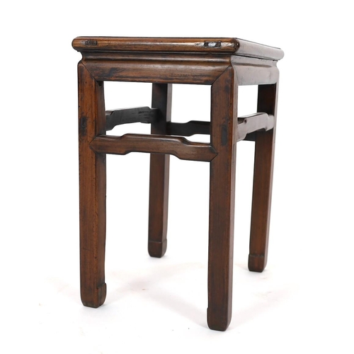 174 - A Chinese huanghuali and hongmu stool, 18th/19th century, the panelled rectangular top above a round... 