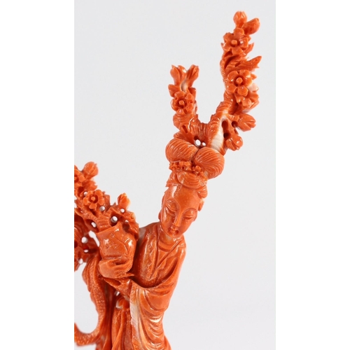 175 - A Chinese carved coral figure of a flower fairy, 20th century, the figure holding a vase of flowers ... 