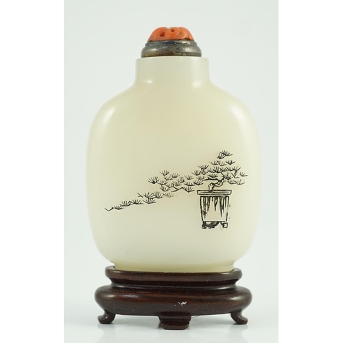 188 - A Chinese inscribed white jade snuff bottle, 19th century, the stone is of good even tone, the bottl... 