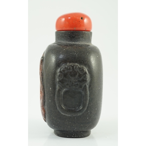 191 - A Chinese two colour marble cameo tiger snuff bottle, 19th century, of flattened oblong form, the ... 