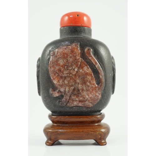 191 - A Chinese two colour marble cameo tiger snuff bottle, 19th century, of flattened oblong form, the ... 