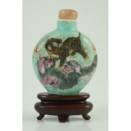 196 - A Chinese enamelled porcelain mythical beasts snuff bottle, 1850-1900, painted with a tiger, two B... 