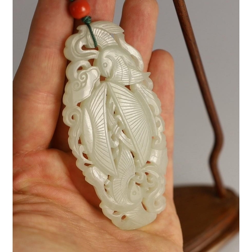 208 - A Chinese white jade twin phoenix reticulated plaque, 19th century, pierced and carved with a centra... 