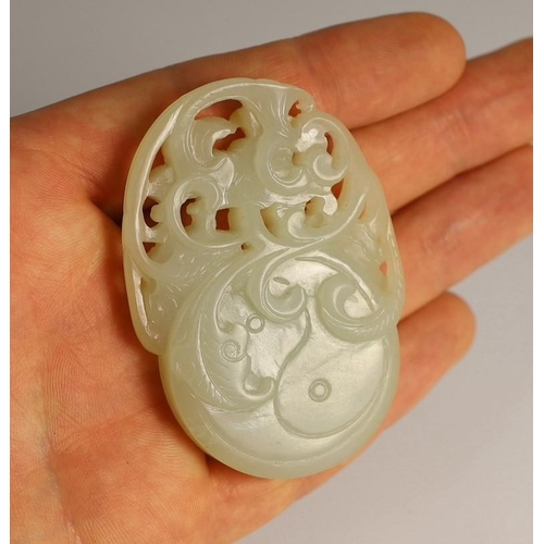 209 - A Chinese white and russet skin jade oval plaque, 19th century, skilfully carved in relief and openw... 