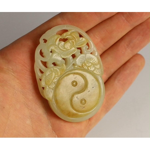 209 - A Chinese white and russet skin jade oval plaque, 19th century, skilfully carved in relief and openw... 