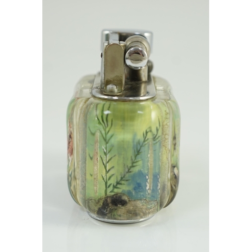 21 - A Dunhill Aquarium table lighter, with chromed metal mount, decorated with a Siamese fighting fish a... 