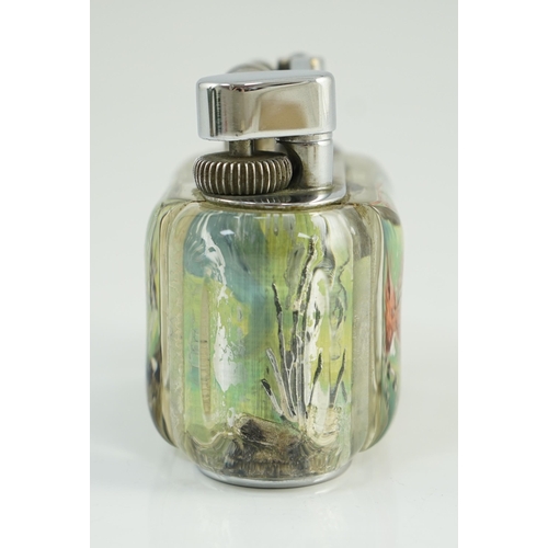 21 - A Dunhill Aquarium table lighter, with chromed metal mount, decorated with a Siamese fighting fish a... 