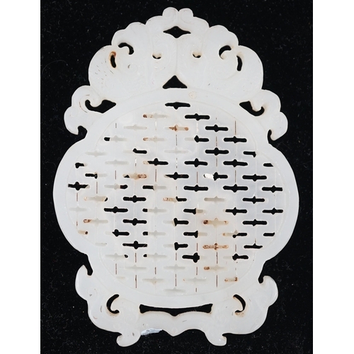 216 - A Chinese white jade reticulated plaque, 19th century, carved in high relief and openwork with a sag... 