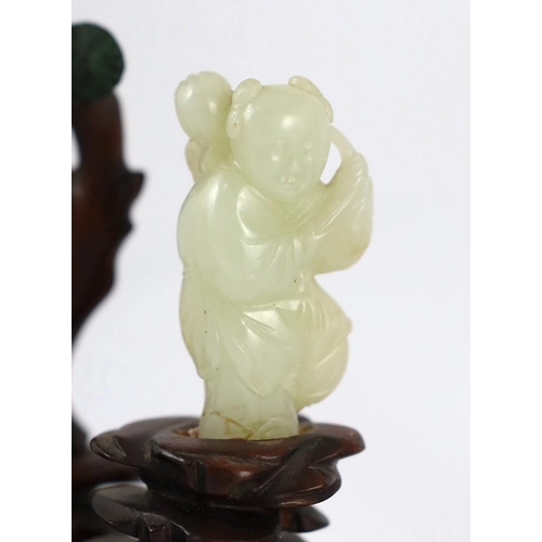 217 - An assembled group of four Chinese pale celadon jade figures, 18th/19th century, the first a group o... 