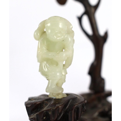 217 - An assembled group of four Chinese pale celadon jade figures, 18th/19th century, the first a group o... 