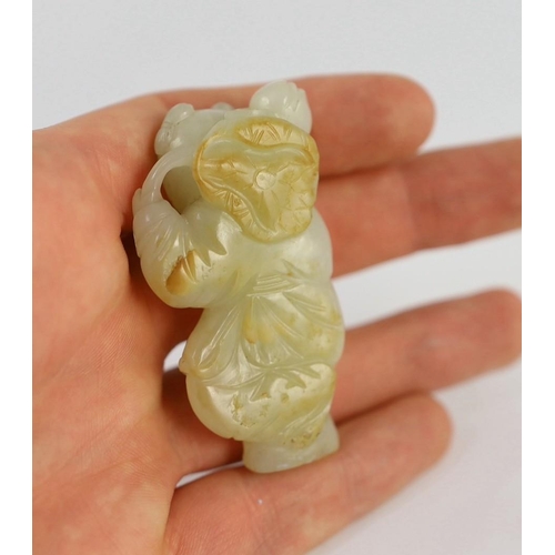 217 - An assembled group of four Chinese pale celadon jade figures, 18th/19th century, the first a group o... 