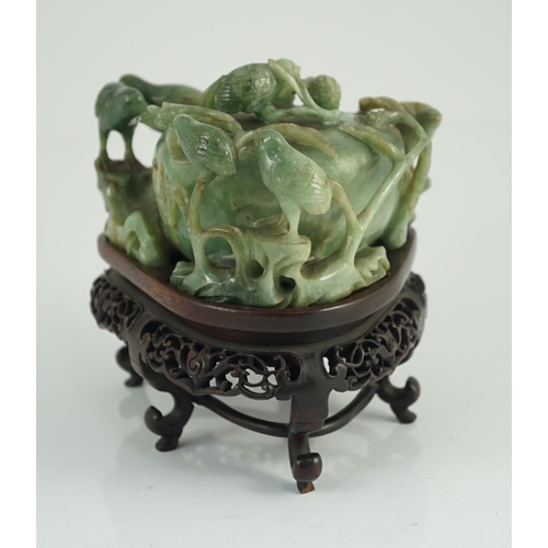 222 - A Chinese jadeite quail and millet water pot and stand, late 19th century, carved in high relief a... 