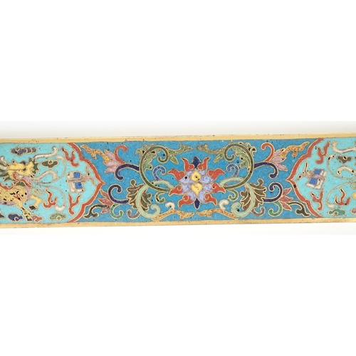 225 - A Chinese cloisonné enamel and gilt bronze scroll weight, decorated in colours with two qilin, lotus... 