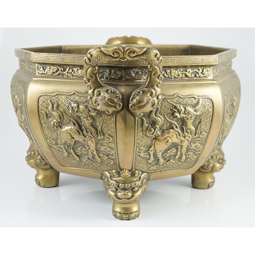 227 - A large Chinese polished bronze octagonal jardiniere, 19th century, each side cast in relief with a ... 